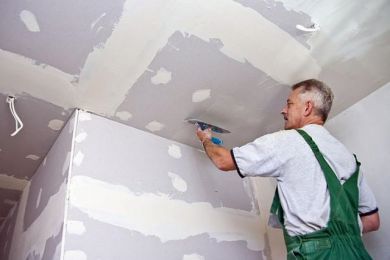 Drywall professional at work - If you specialize in drywall, you need affordable liability coverage